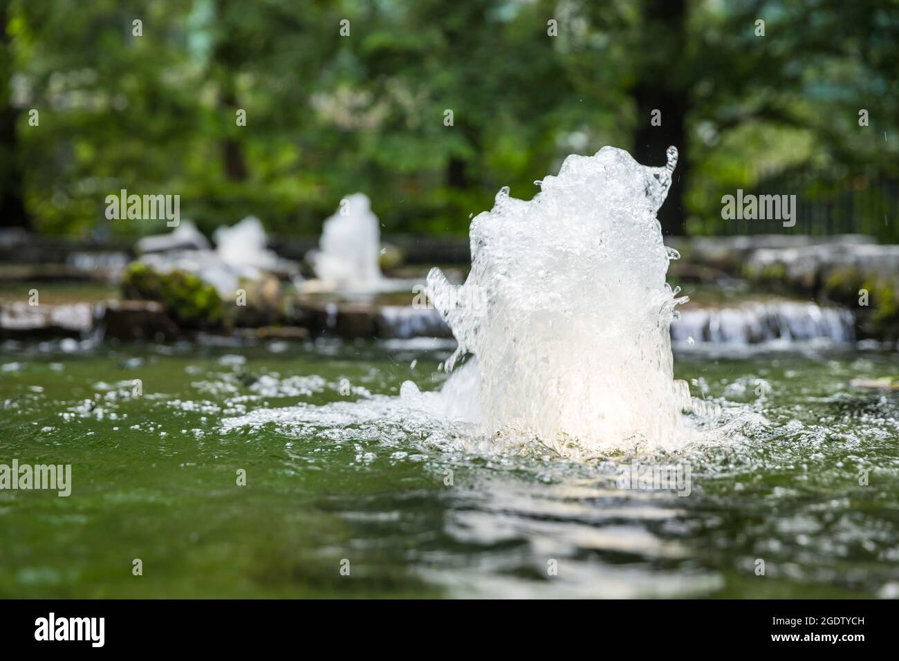 Small water jet in a water feature Stock Photo