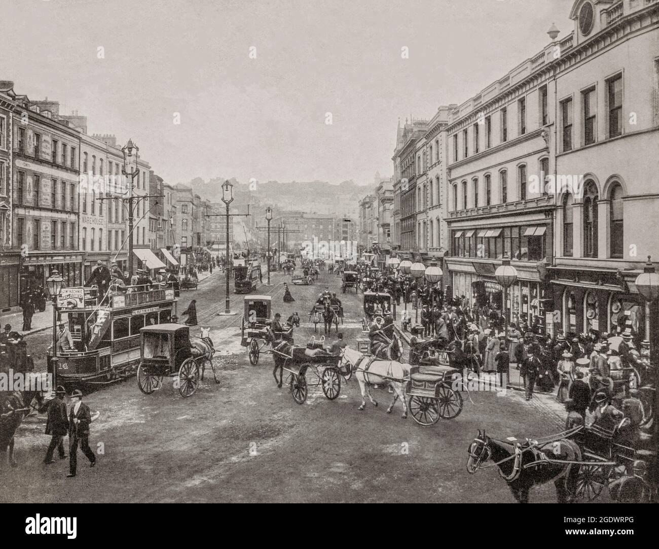 An early 20th century view of St Patrick's Street in Cork City, the second largest city in Ireland. The street dates from the late 18th century, when the city expanded beyond the walls of the ancient city, which was centered on North and South Main Streets. From 1898 to 1931, the street was served by the Cork Electric Tramways and Lighting Company when services started on 22 December 1898. Stock Photo