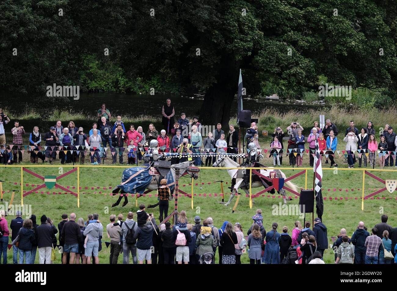 Melrose, Scotland, UK. 15th Aug, 2021. Les Amis, jousting knights & horsemanship display from the medieval period, in tribute to Sir Walter Scotts 'Ivanhoe' The inaugural festival, ScottFest 2021, is being held at Abbotsford, Scott's home in the Scottish Borders, over the legendary author's 250th birthday weekend, Saturday August 14th and Sunday August 15th. The event, funded this year by EventScotland, is based on Ivanhoe and will feature jousting, stunt horse riding, living history displays, falconry and traditional crafts, plus archery, live music and Scottish dancing. Rob Gray Stock Photo