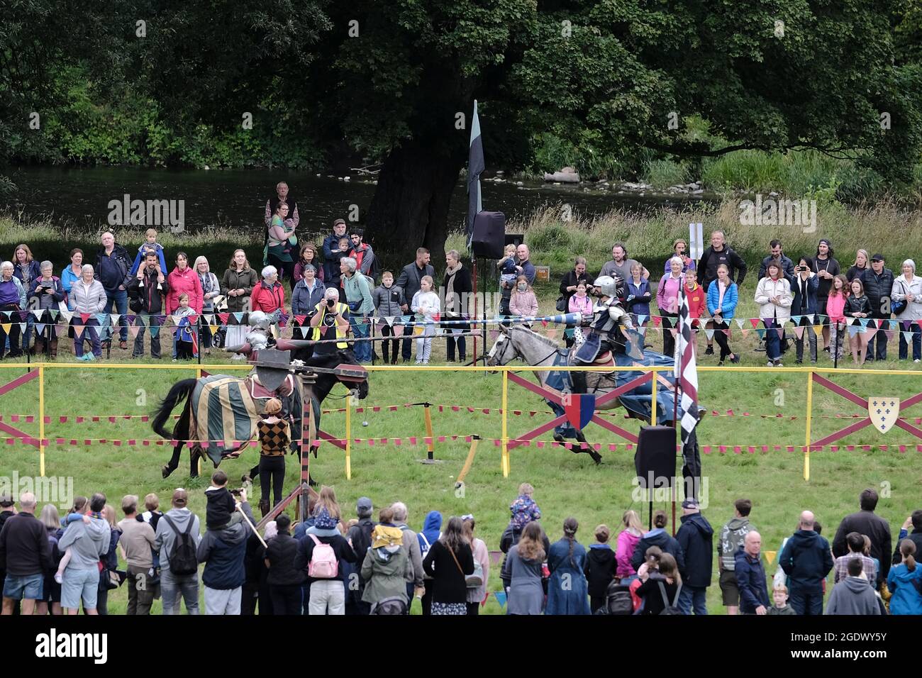 Melrose, UK, 15th August, 2021. Les Amis, jousting knights & horsemanship display from the medieval period, in tribute to Sir Walter Scotts 'Ivanhoe' The inaugural festival, ScottFest 2021, is being held at Abbotsford, ScottÕs home in the Scottish Borders, over the legendary authorÕs 250th birthday weekend, Saturday August 14th and Sunday August 15th. The event, funded this year by EventScotland, is based on Ivanhoe and will feature jousting, stunt horse riding, living history displays, falconry and traditional crafts, plus archery, live music and Scottish dancing. Rob Gray Stock Photo