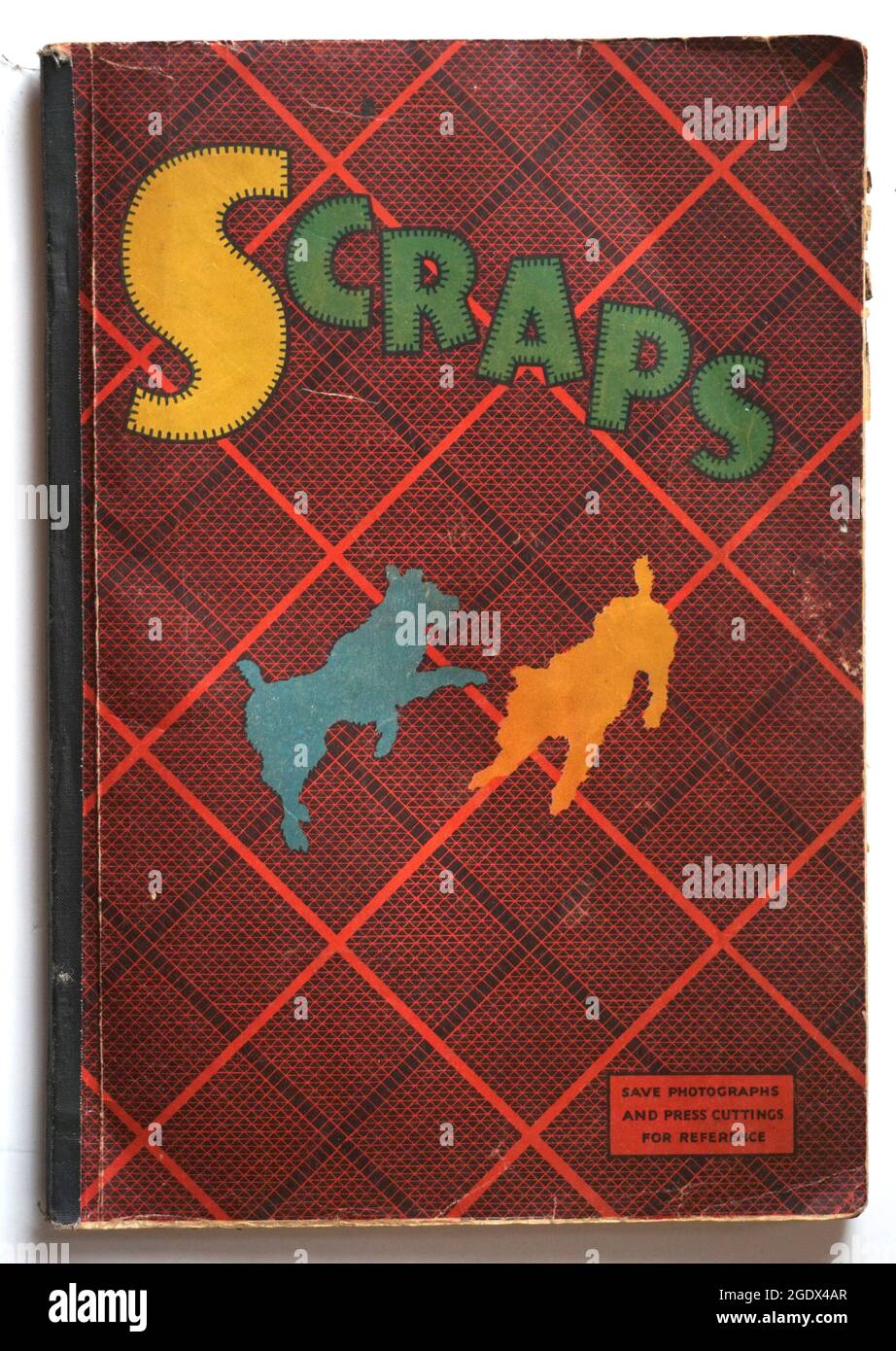 Vintage scrapbook covers, Forties and fifties. These have lovely vintage designs, terrier dogs, tartan and abstract painted backgrounds.  As used by children to keep their cutting and crafting collections in. Stock Photo