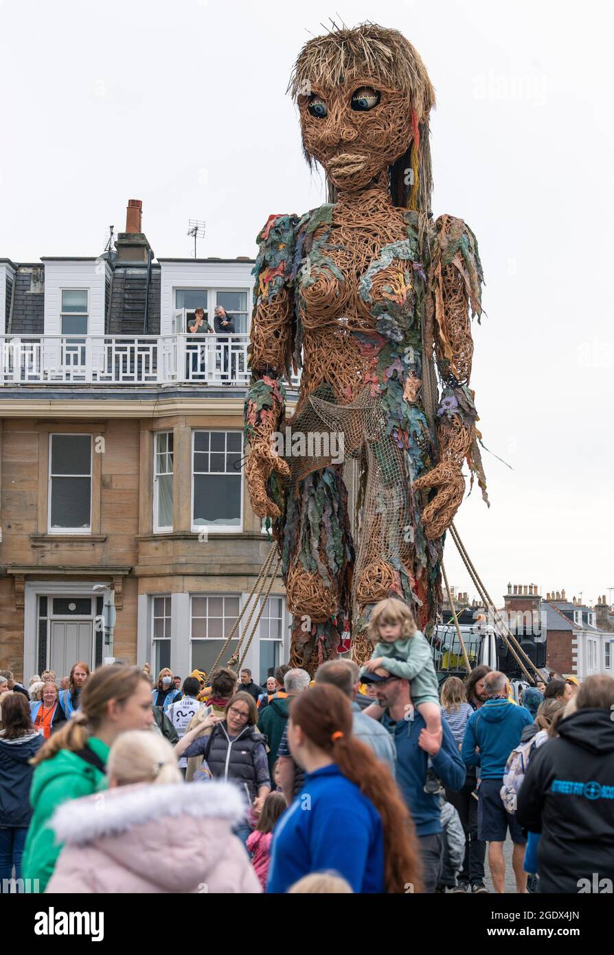 Storm, a ten-metre tall puppet of a mythical goddess of the sea created by Edinburgh-based visual theatre company Vision Mechanics, makes its way alongside the seafront at North Berwick, East Lothian, during a performance at the Fringe By The Sea festival. Picture date: Sunday August 15, 2021. Stock Photo