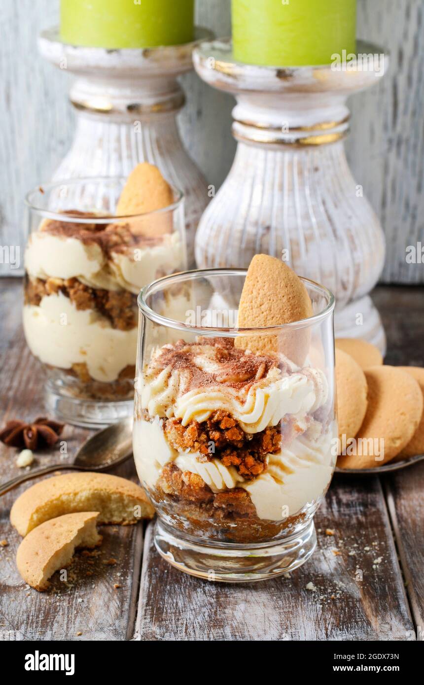Tiramisu dessert in glass jar. Party time Stock Photo - Alamy