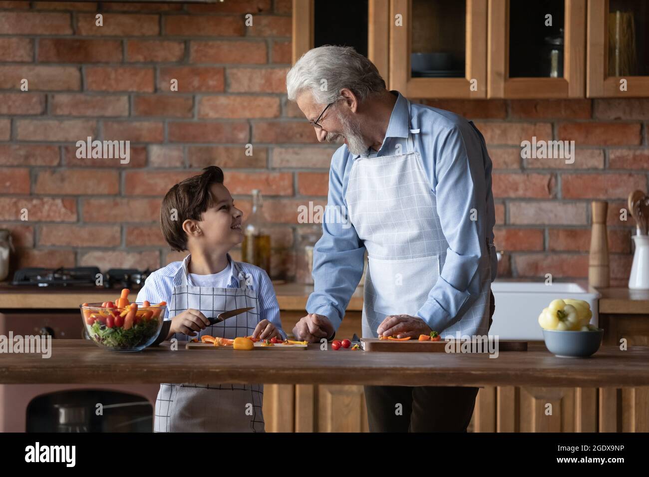 Male kid and grandfather cooking hi-res stock photography and images ...
