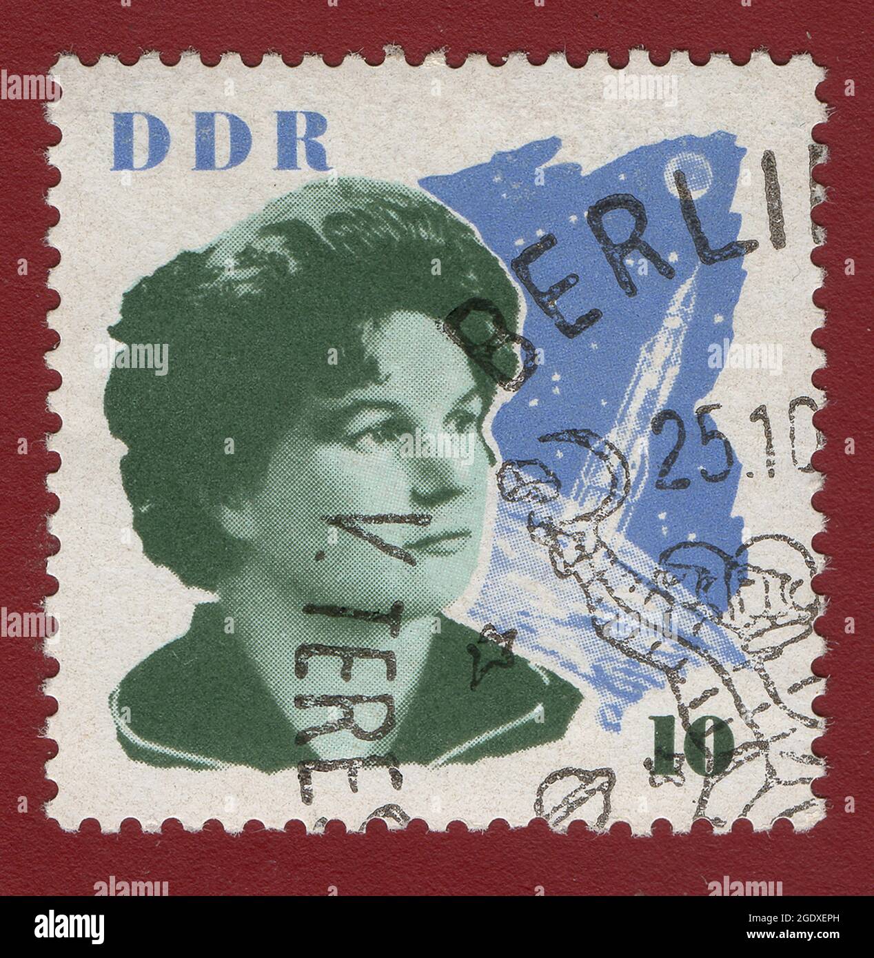 GERMAN DEMOCRATIC REPUBLIC - CIRCA 1963 : Cancelled postage stamp printed by German Democratic Republic, that shows Valentina Tereshkova and space cra Stock Photo