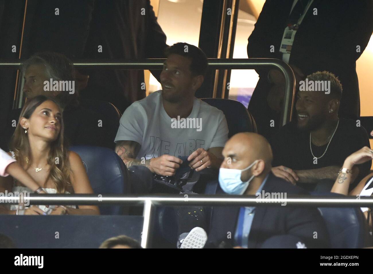 Paris SaintGermain's Argentinian forward Lionel Messi (R) watches the French L1 football match