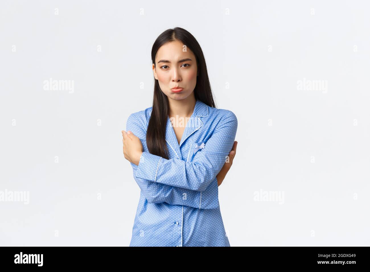 Timid And Upset Sulking Cute Asian Girl In Blue Pajamas Feeling