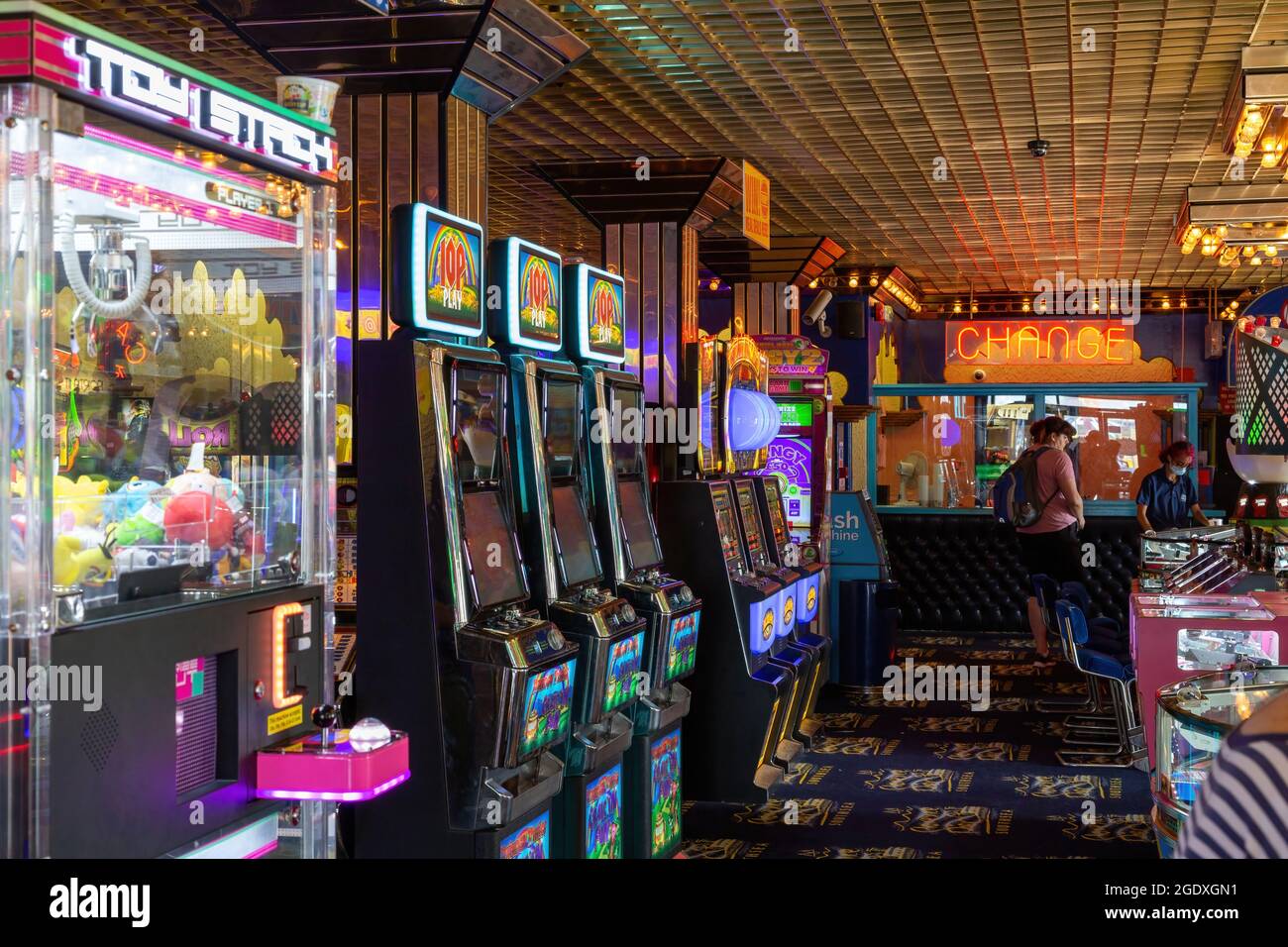 08-12-2021 Portsmouth, Hampshire, UK Arcade games and fruit machines in an amusement arcade with neao lights Stock Photo