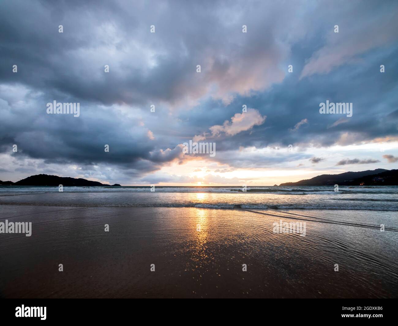 Beautiful sunset over the calm sea with cloud and sky background ...