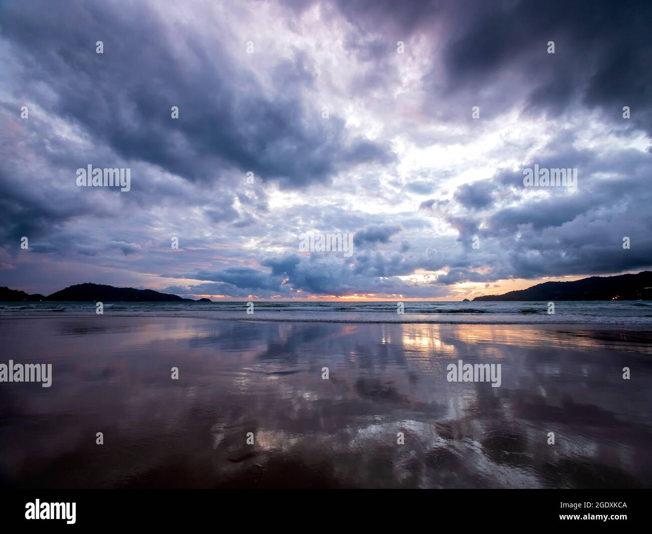 Beautiful sunset over the calm sea with cloud and sky background ...