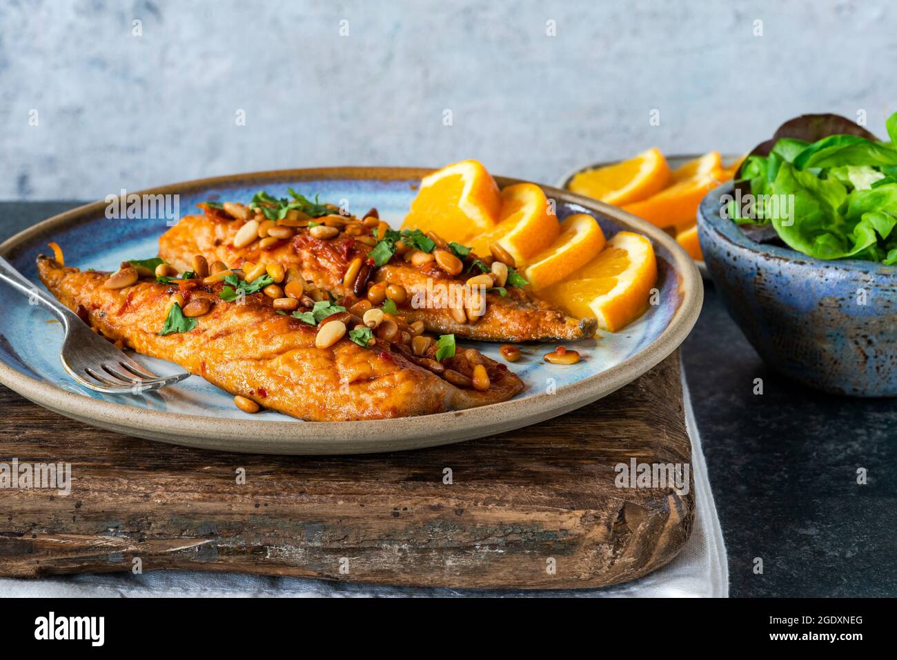 Mackerel fillets with orange and harissa glaze, green leaf salad and