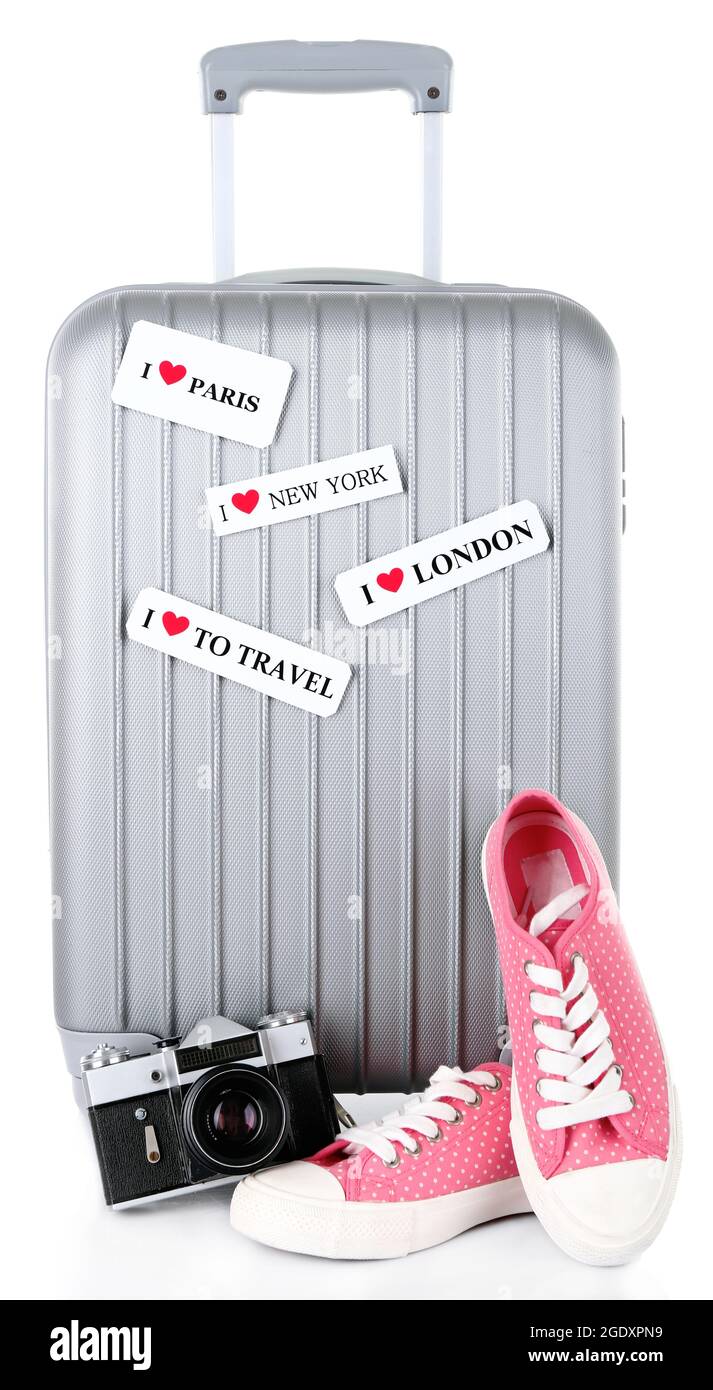 Travel suitcase, converse, photo camera and hat isolated on white Stock  Photo - Alamy