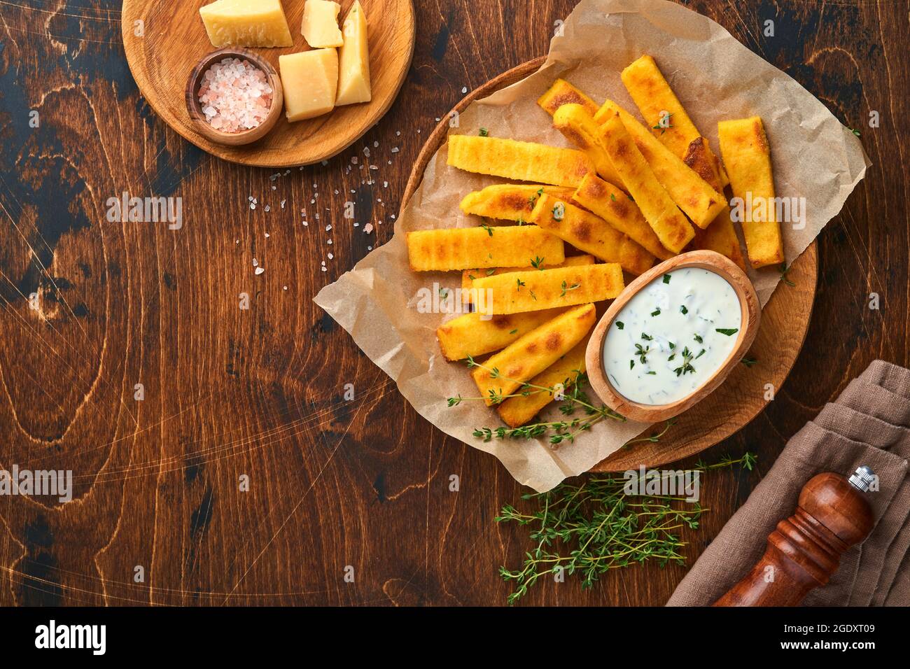 Homemade polenta chips fries with sea salt, parmesan, thyme, rosemary