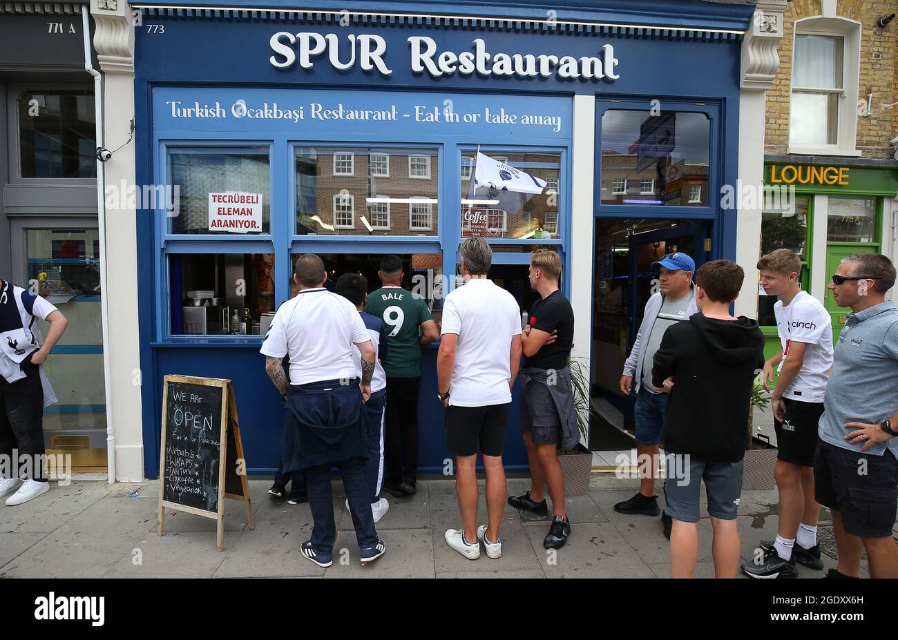 London, UK. 15th Aug, 2021. Tottenham Fans queue for food at a local restaurant ahead of the Premier League match at the Tottenham Hotspur Stadium, London. Picture credit should read: Paul Terry/Sportimage Credit: Sportimage/Alamy Live News Stock Photo