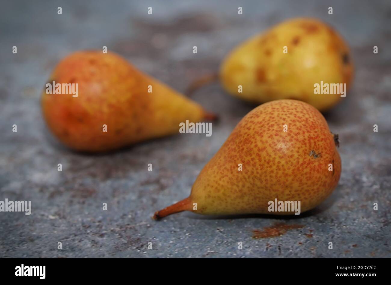 Ripe pears on rustic table Stock Photo