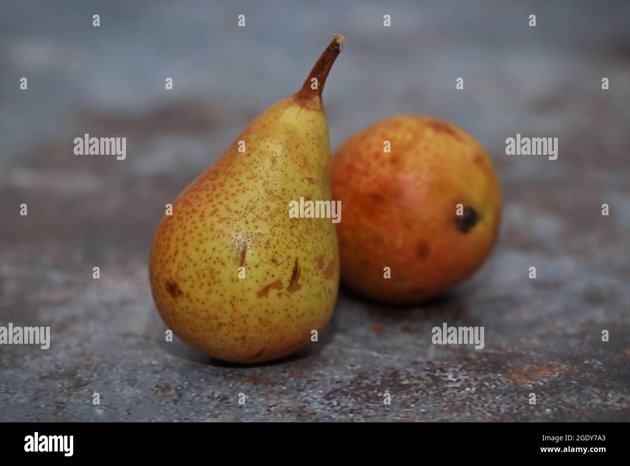 Ripe pears on rustic table Stock Photo