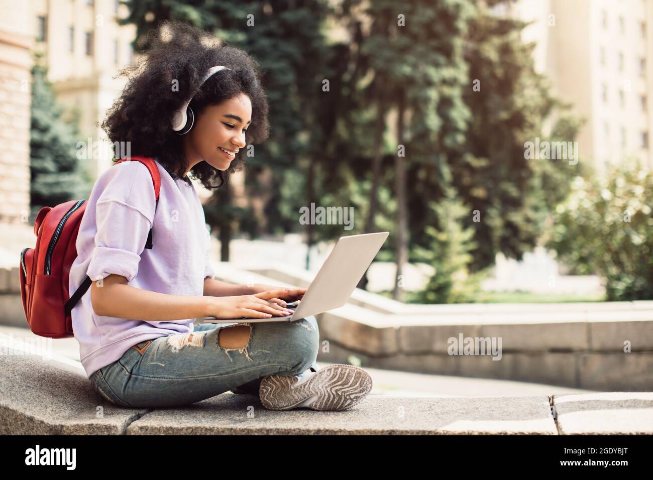 African American Female Student Using Laptop Learning Sitting Outdoor ...