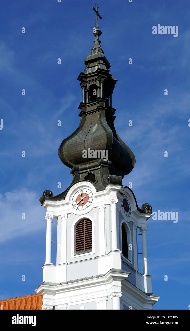 The white tower of the Christian church of the Glorious Name of Mary in the Croatian city of Osijek Stock Photo