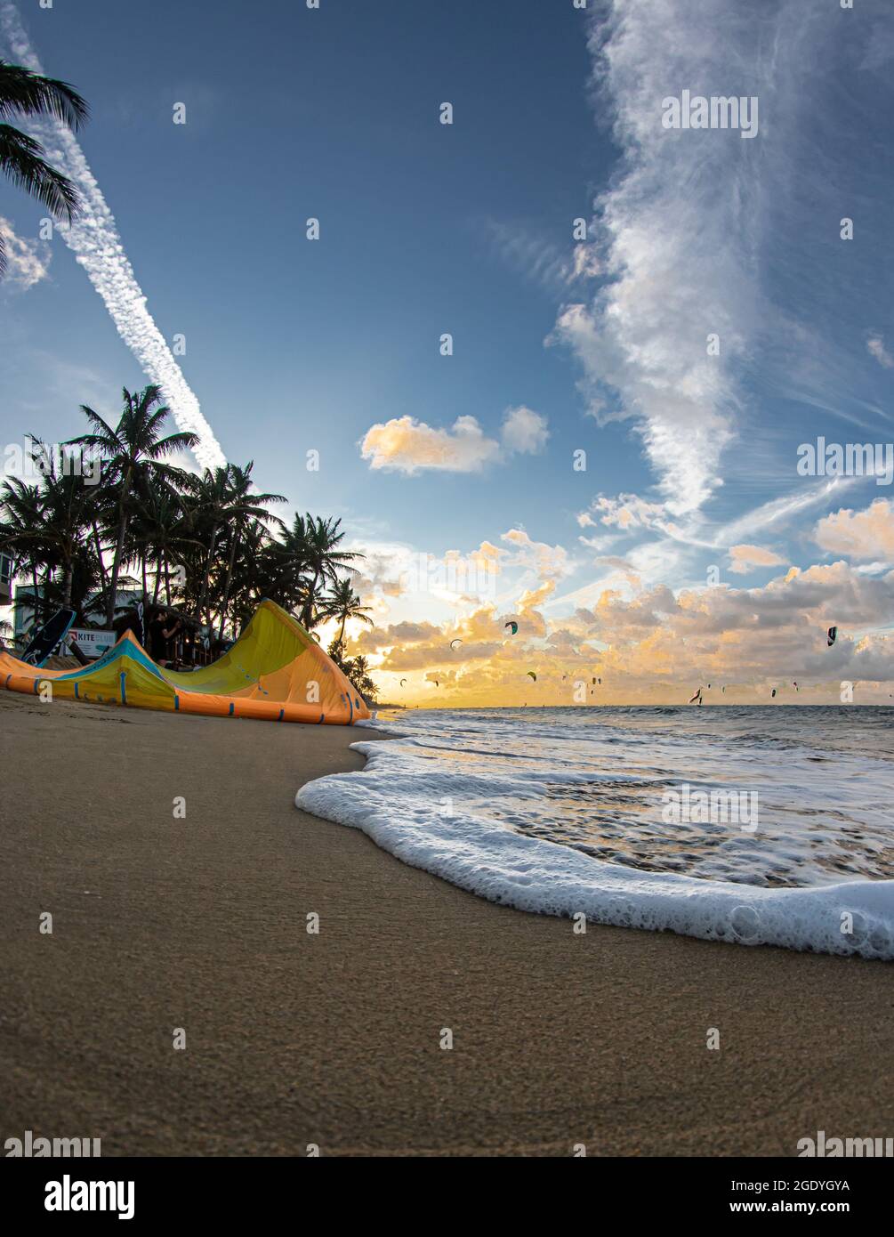 The sunset over the sea captured from the sandy beach Stock Photo - Alamy
