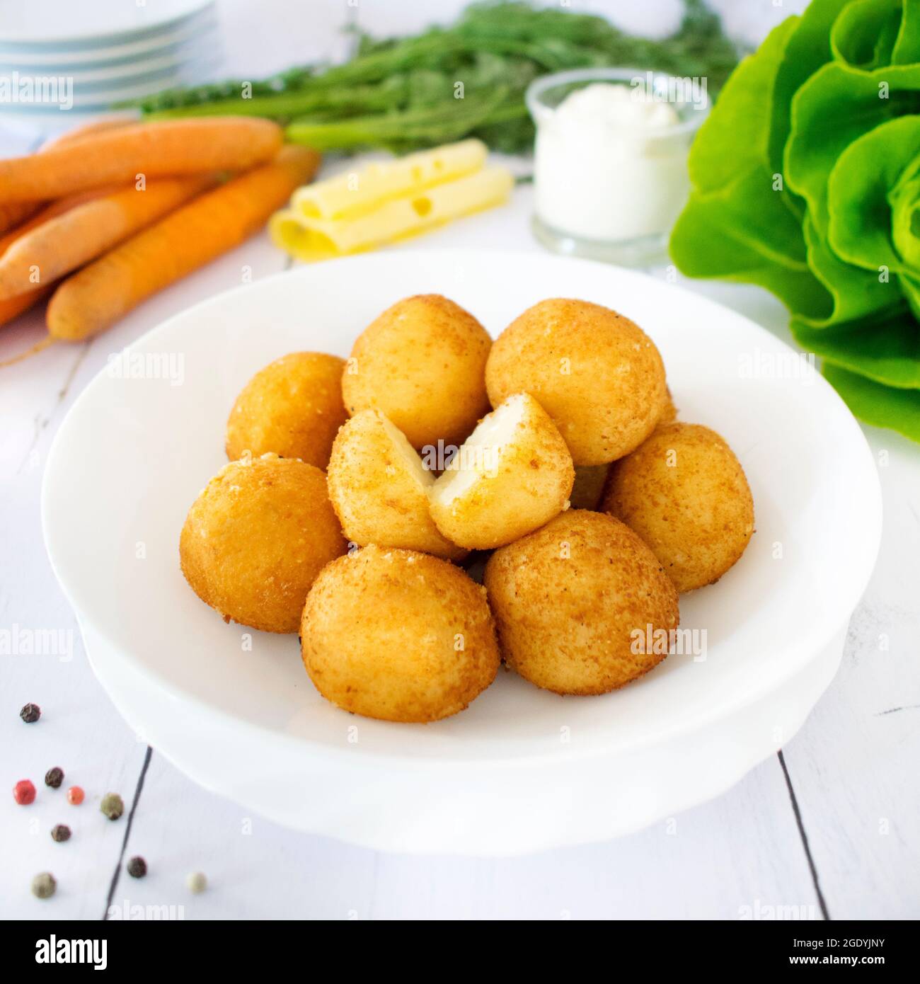 Two Potato Balls Are Partially Eaten With Cheese In The Middle Background,  Croquette On White Background, Hd Photography Photo Background Image And  Wallpaper for Free Download