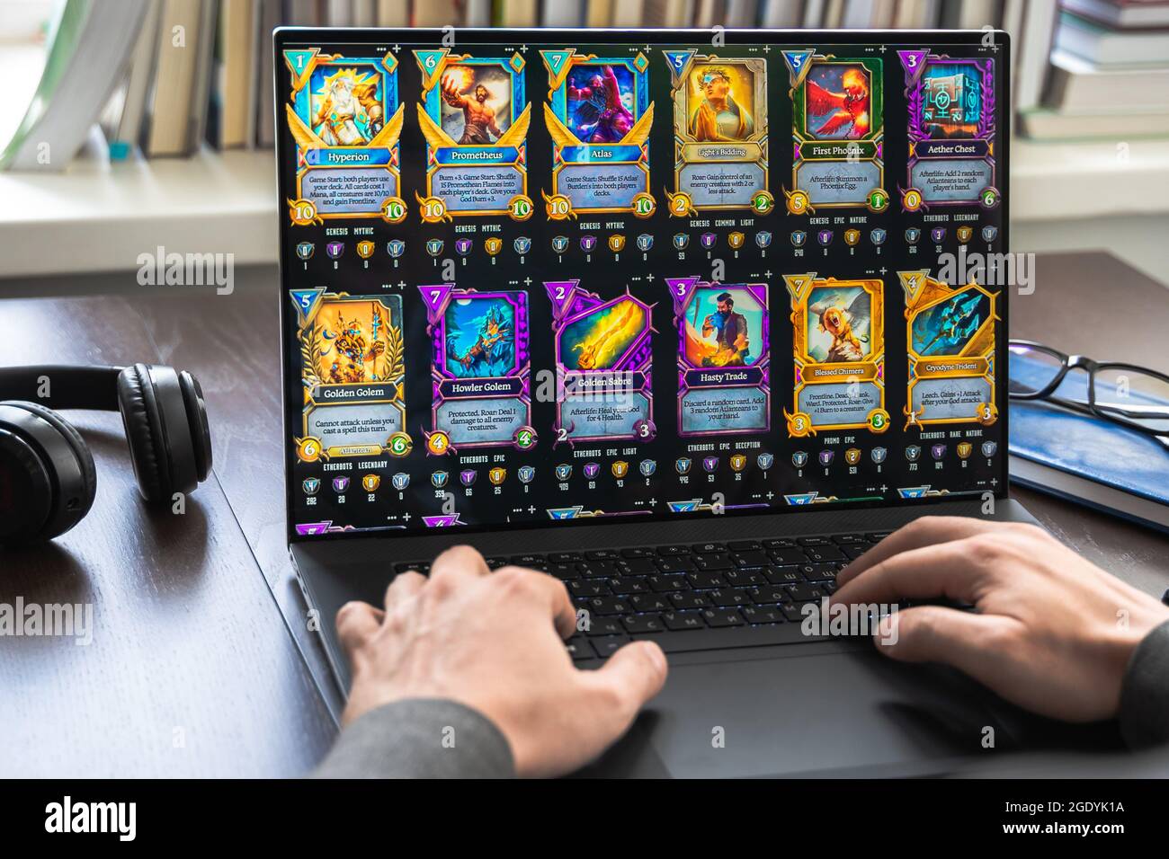 Russia Moscow 30.05.2021.Logo, screenshot of blockchain nft ethereum  cryptocurrency game Unchained gods in laptop.Man playing,collecting cards, crypto Stock Photo - Alamy
