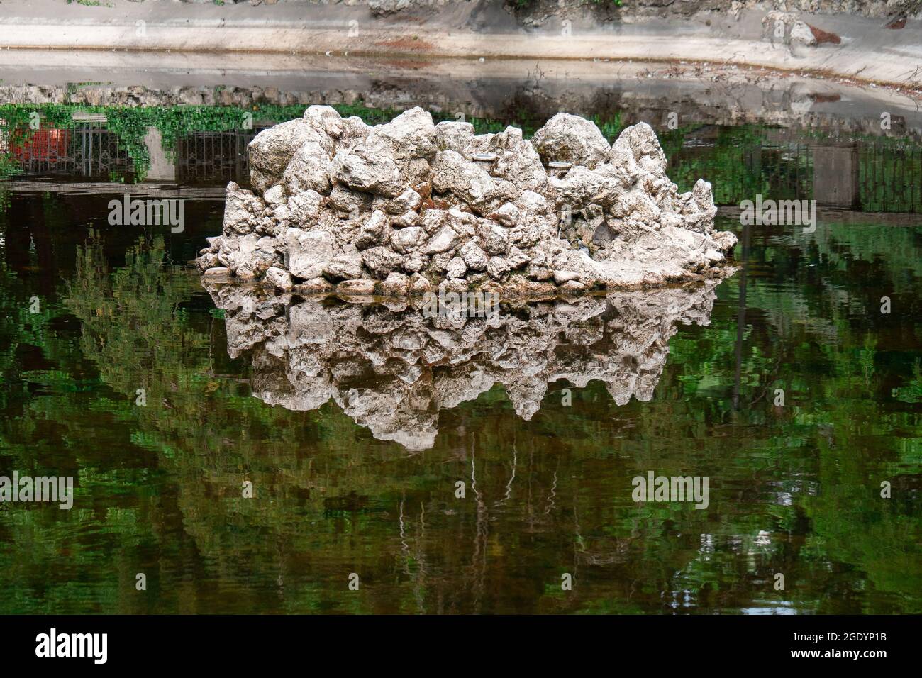 Rocks and their Reflection in a Small Lake Surrounded by Nature Stock ...