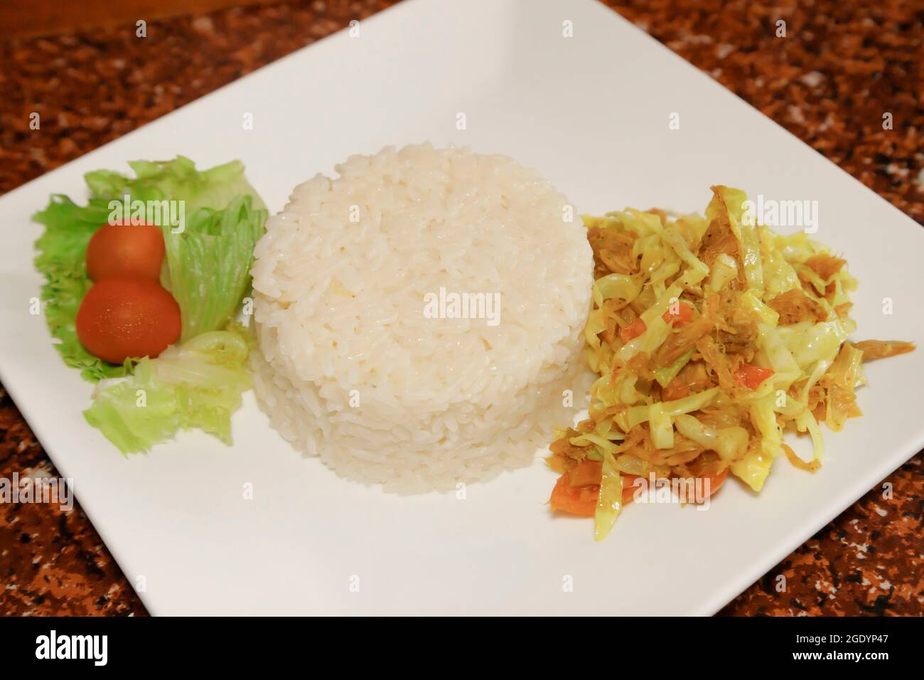 Sunday lunch meal with veggies and codfish Stock Photo