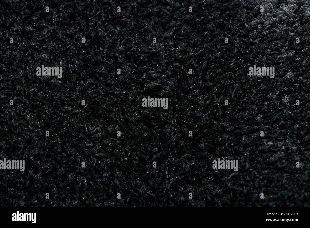 Black alcantara leather surface background texture macro close up view Stock Photo