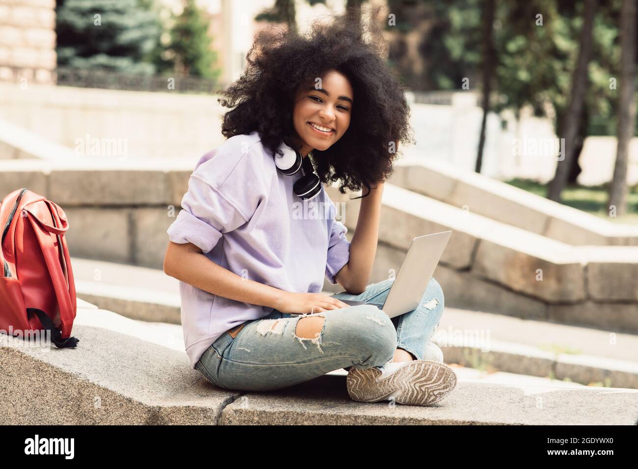 Cheerful African American Student Girl Using Laptop Sitting Outdoors ...