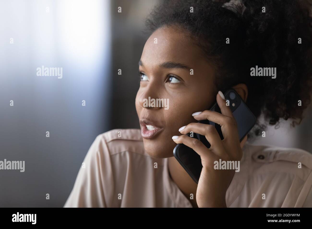 Close up of ethnic woman talk on cellphone call Stock Photo