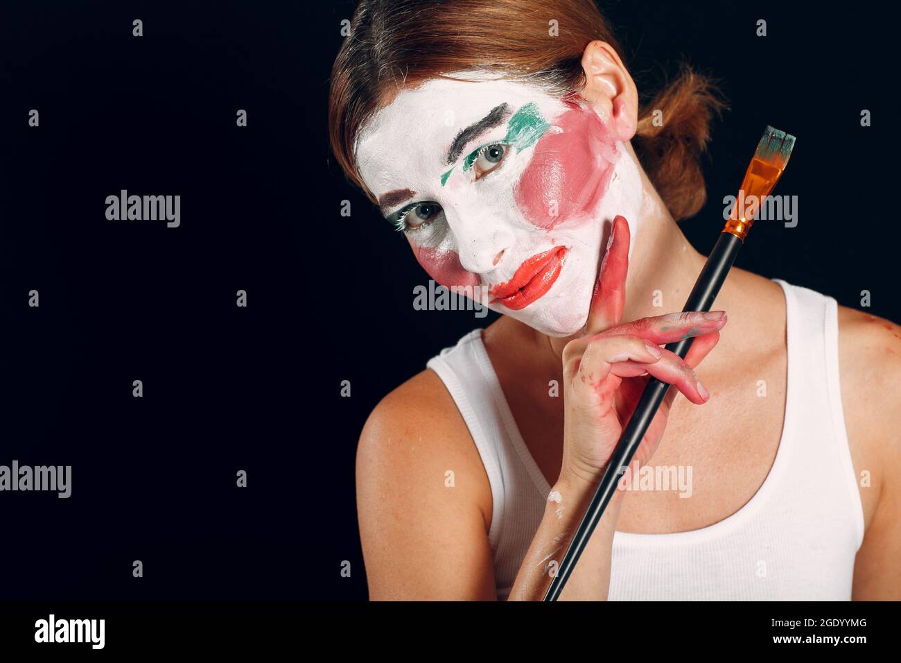 young woman with body painting on her face, ugly scary clown, Halloween  topic Stock Photo - Alamy