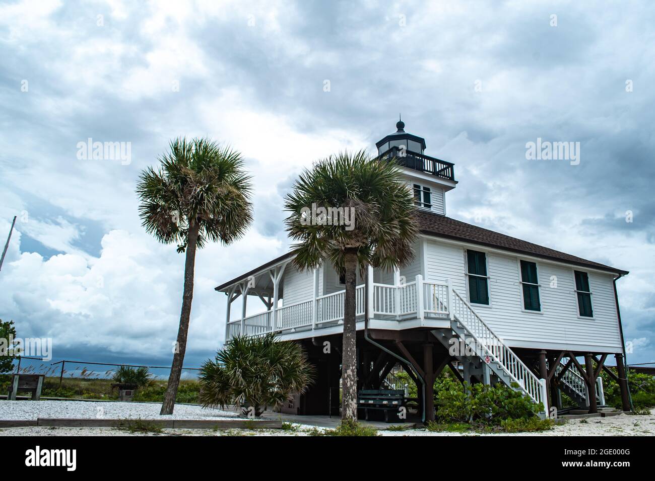 Port Boca Grande Lighthouse and Museum on Gasparilla Island as a tropical storm with black clouds looms off the coast in the Gulf of Mexico Stock Photo