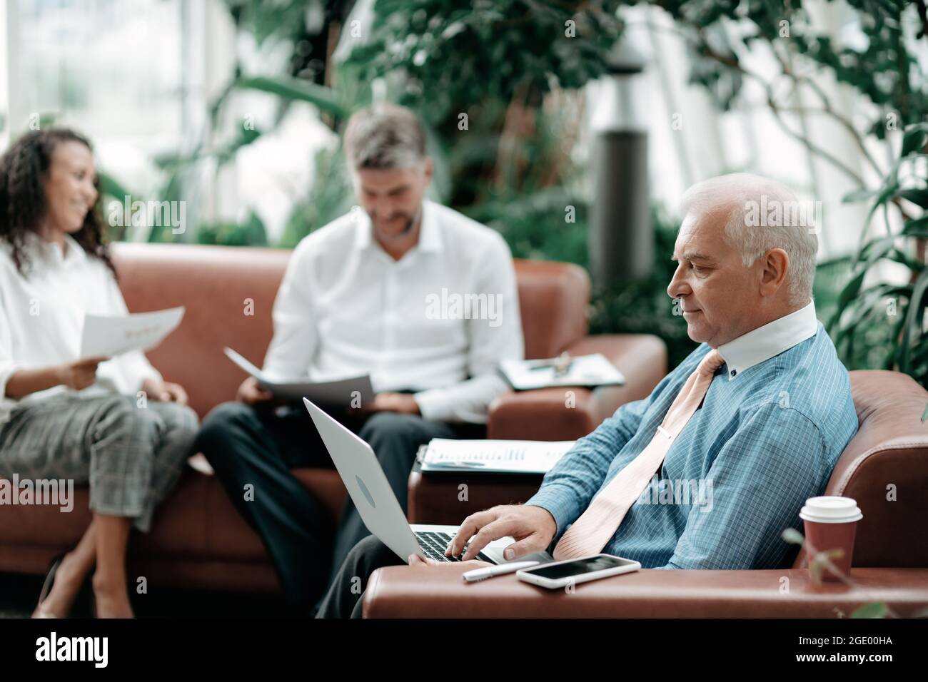 business man using a laptop to check financial data . Stock Photo