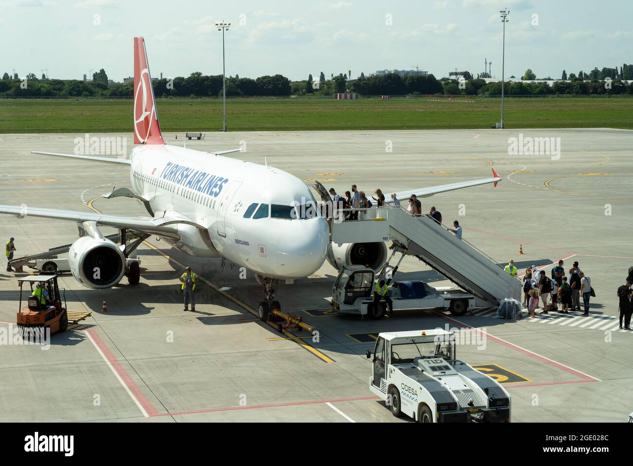 Ukraine, Odessa - August 3, 2021: At the ODS airport await departure. The plane Airbus A319-132 Turkish Airlines. Passengers go up the ladder to the Stock Photo
