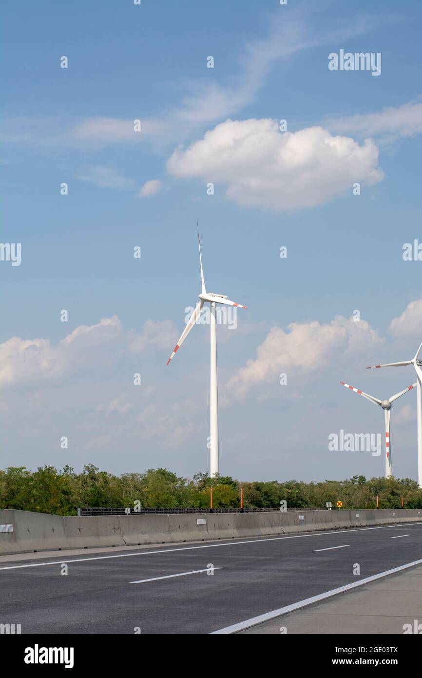 Wind turbines or windmills generating electricity. Renewable electric