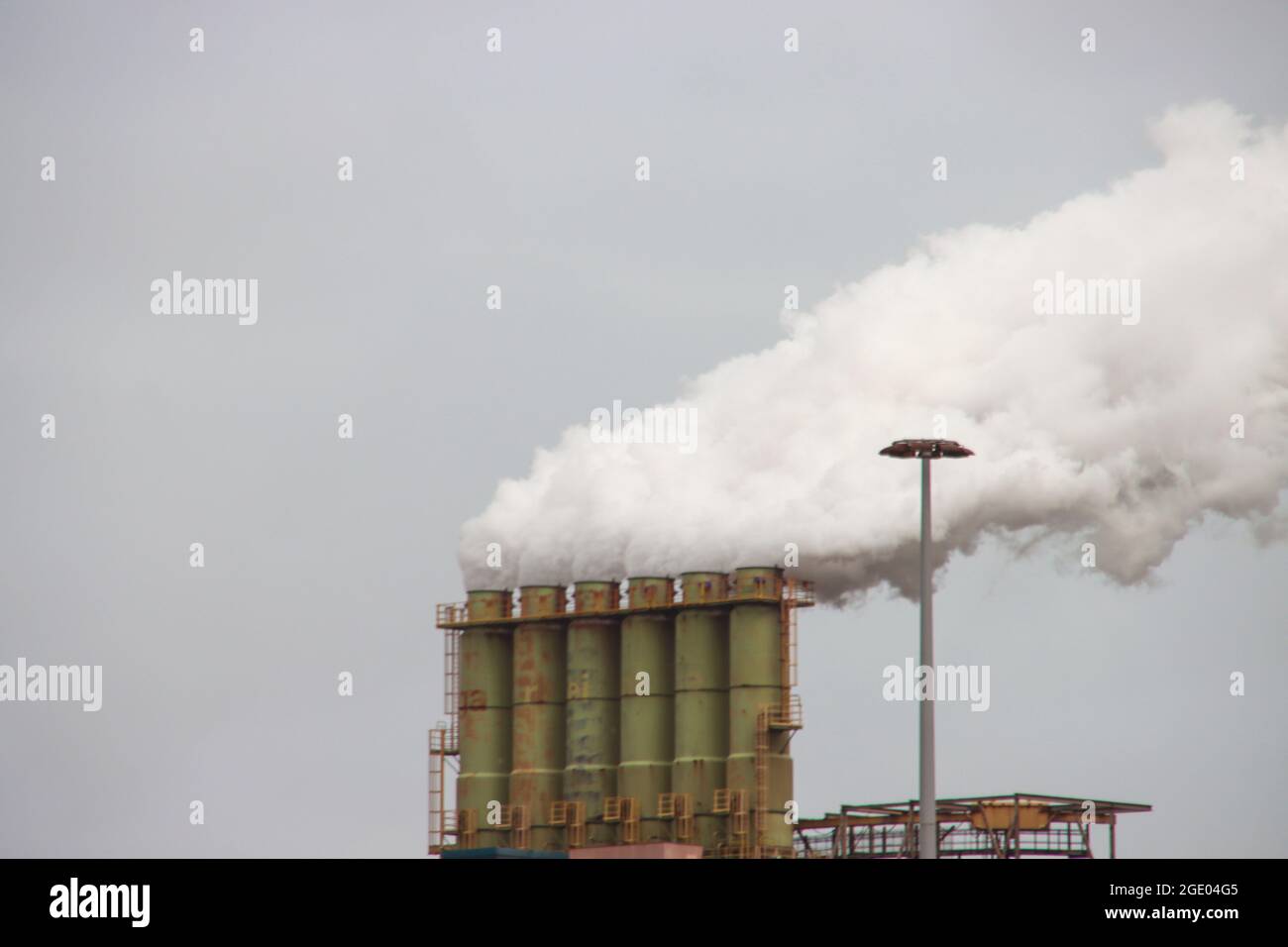 Steam comes out of the Chimneys at Tata steel production plant in IJmuiden the Netherlands Stock Photo