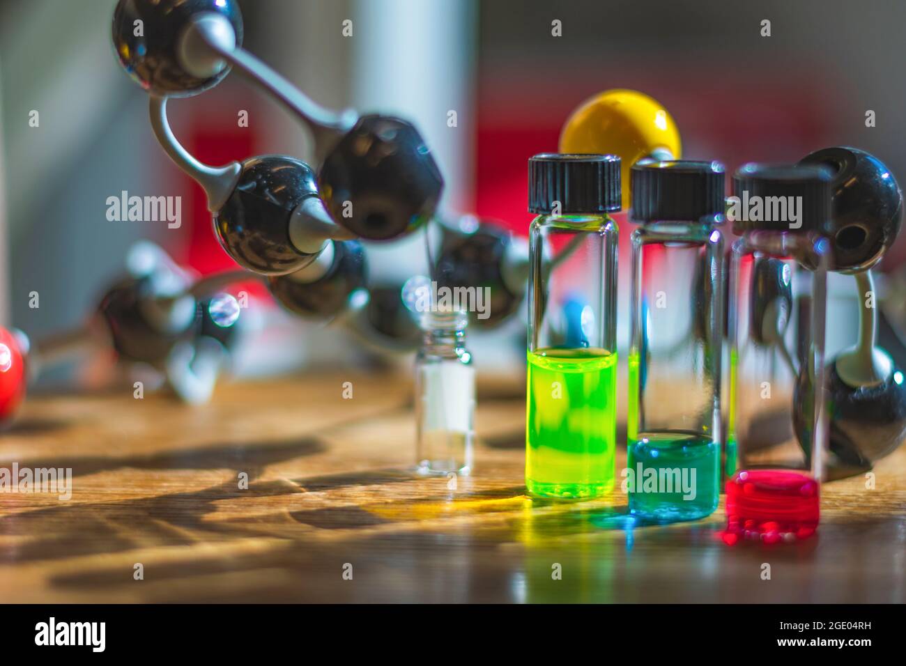 Chemical solutions in different glass vials under the light with
