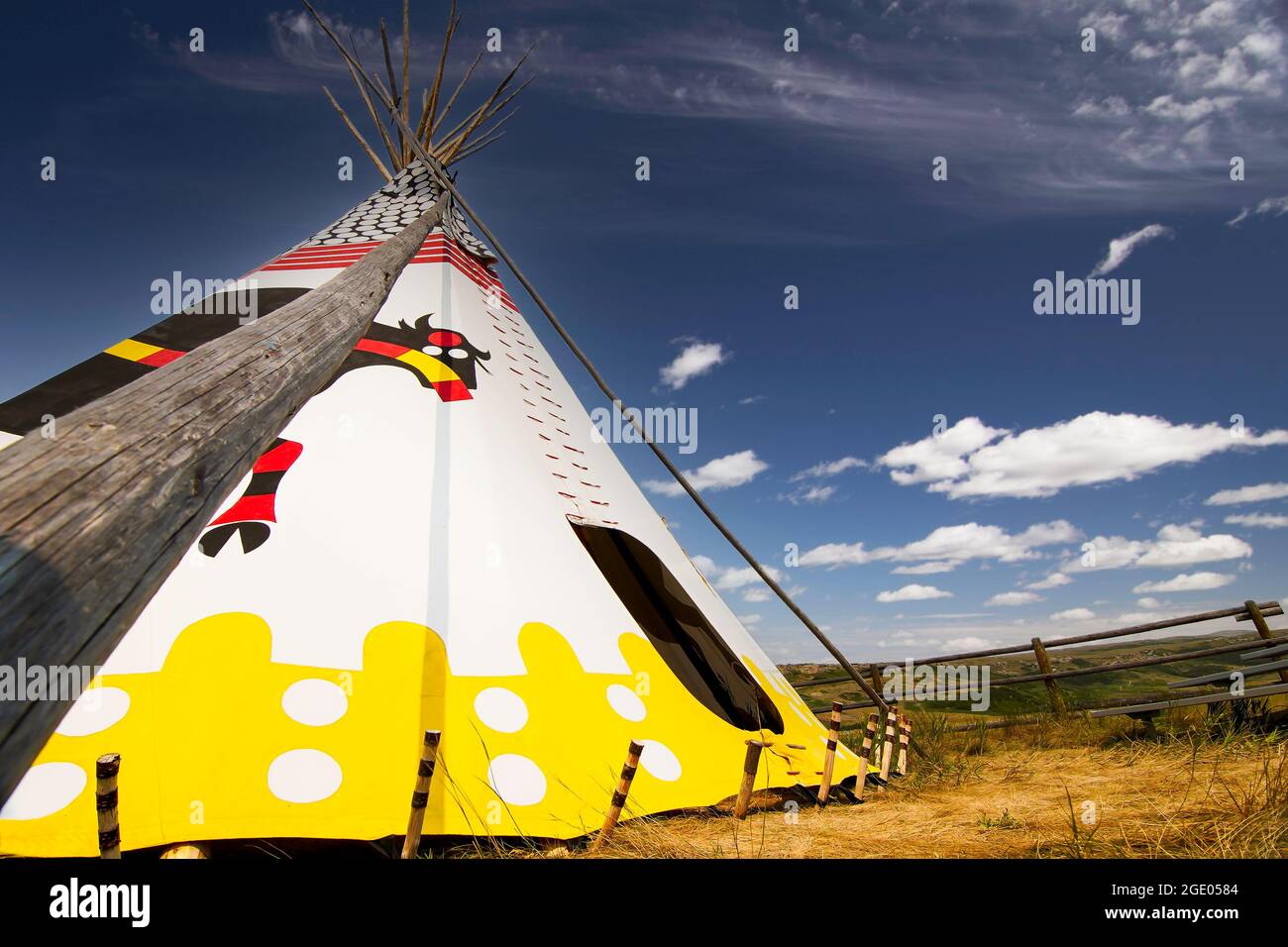 Alberta Alberta Canada, July 30 2021: An indigenous Teepee set up at Head Smashed in Buffalo Jump world heritage site under a blue summer sky. Stock Photo