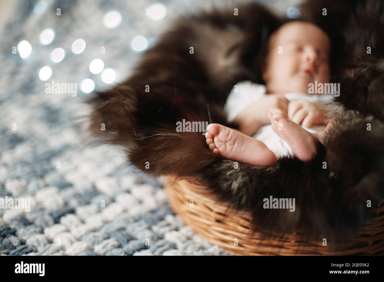 image of a newborn baby sleeping in a baby basket Stock Photo Alamy