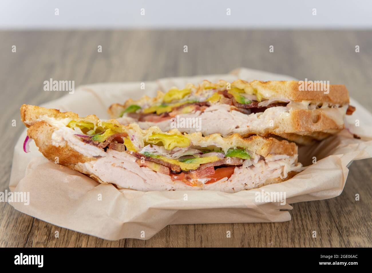 Ham and cheese breakfast panini loaded with all the good fixings to completely fill any appetite for a meal. Stock Photo