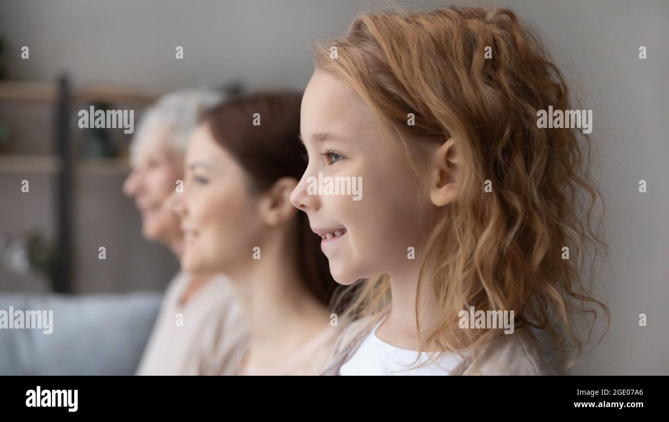 Smiling three generations of women show family unity Stock Photo