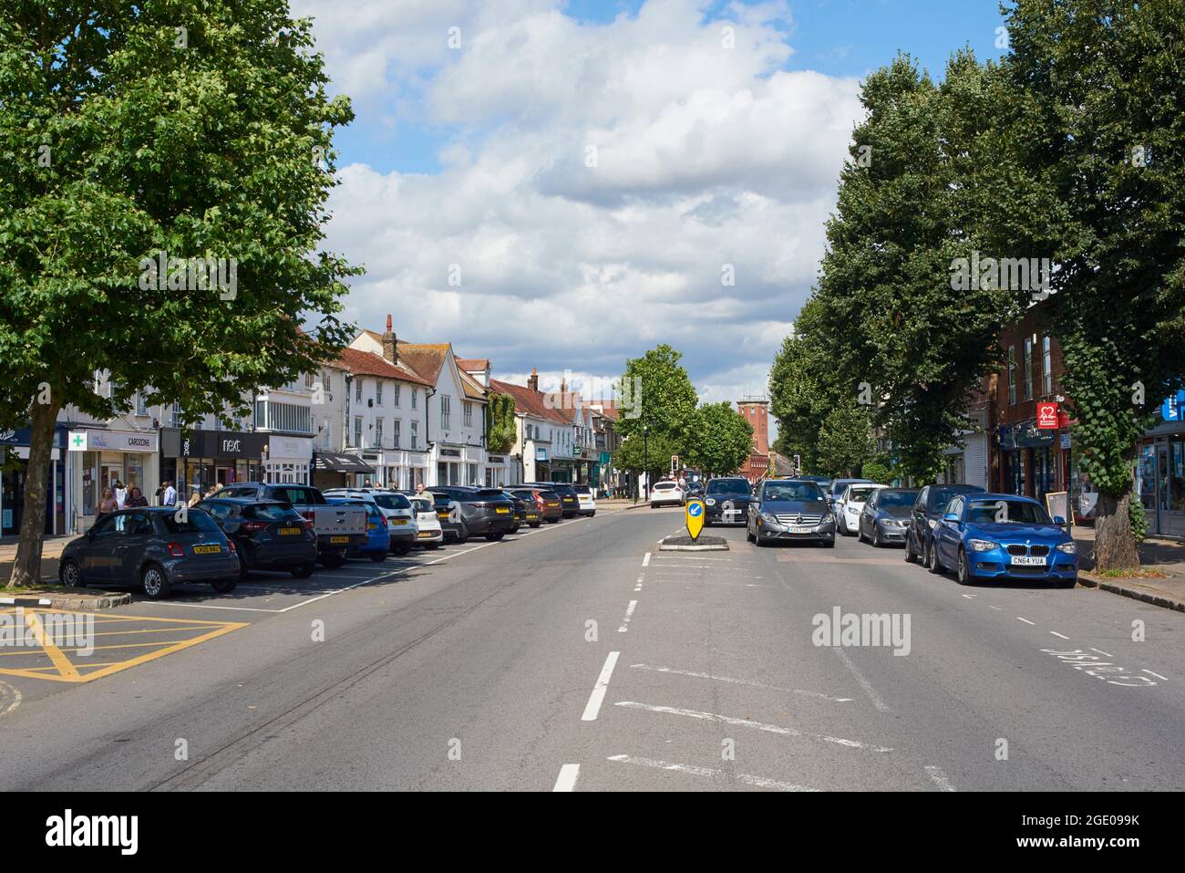 The High Street, Epping, Essex, UK, with traffic and pedestrians Stock Photo
