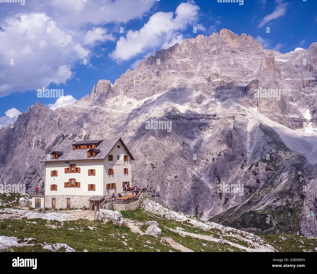 This is the Italian Alpine Club CAI owned Rifugio Comici-Zsigmondy mountain refuge with the Elferkogel peak in the Sexton-Sesto Dolomites region of the Italian Dolomites, the Alto Adige of the Sud Tyrol Stock Photo