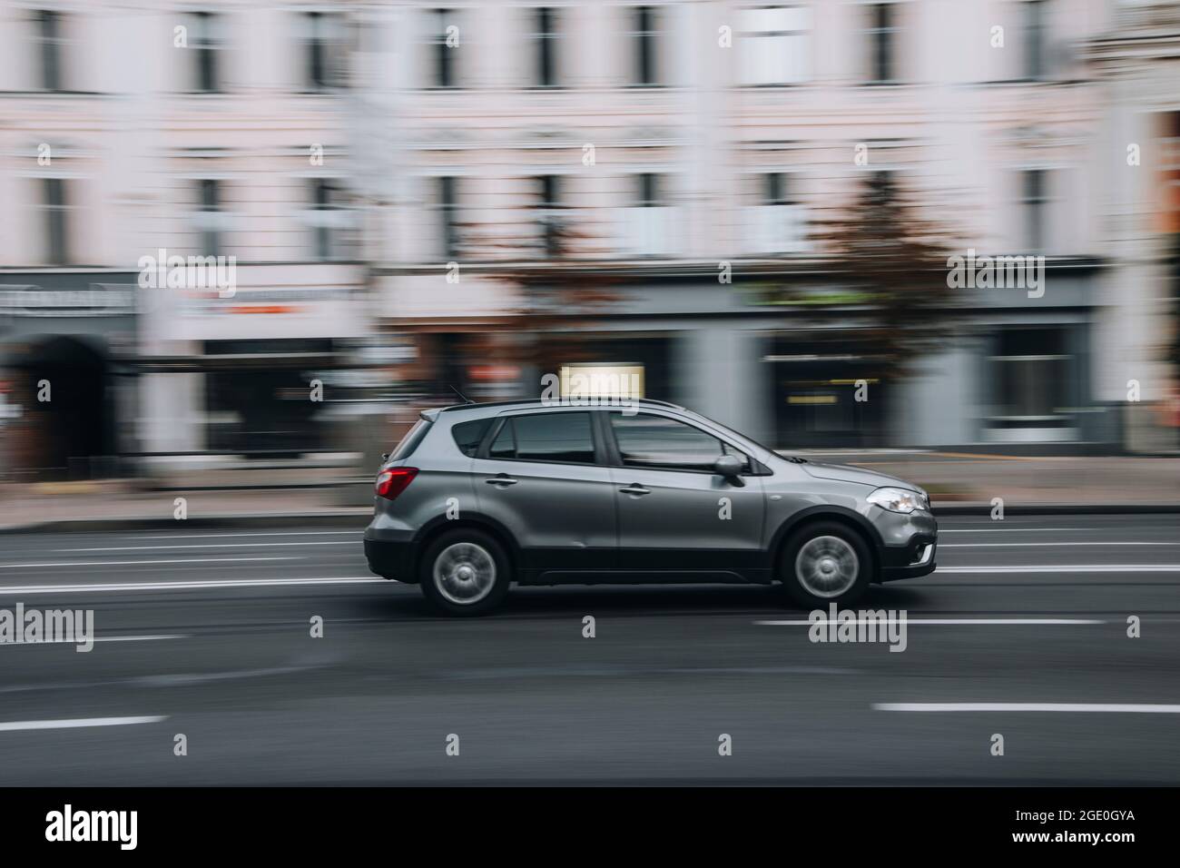 Ukraine, Kyiv - 2 June 2021: Silver Suzuki SX4 car moving on the street. Editorial Stock Photo