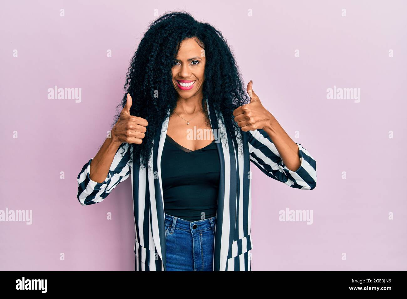 Middle age african american woman wearing casual clothes success sign ...