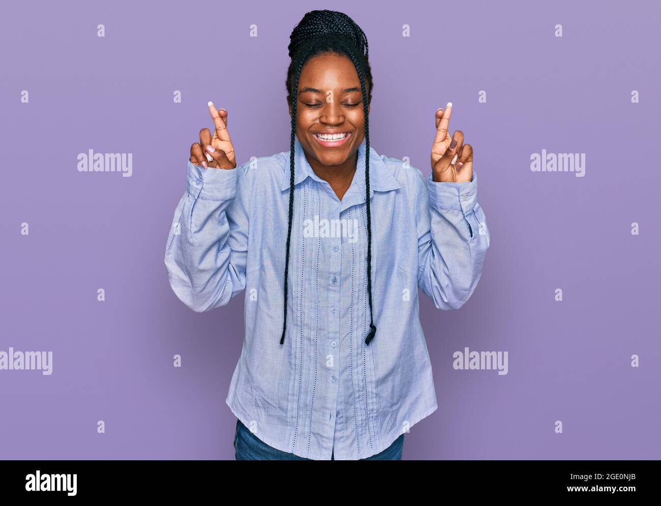 Young african american woman wearing casual clothes gesturing finger ...