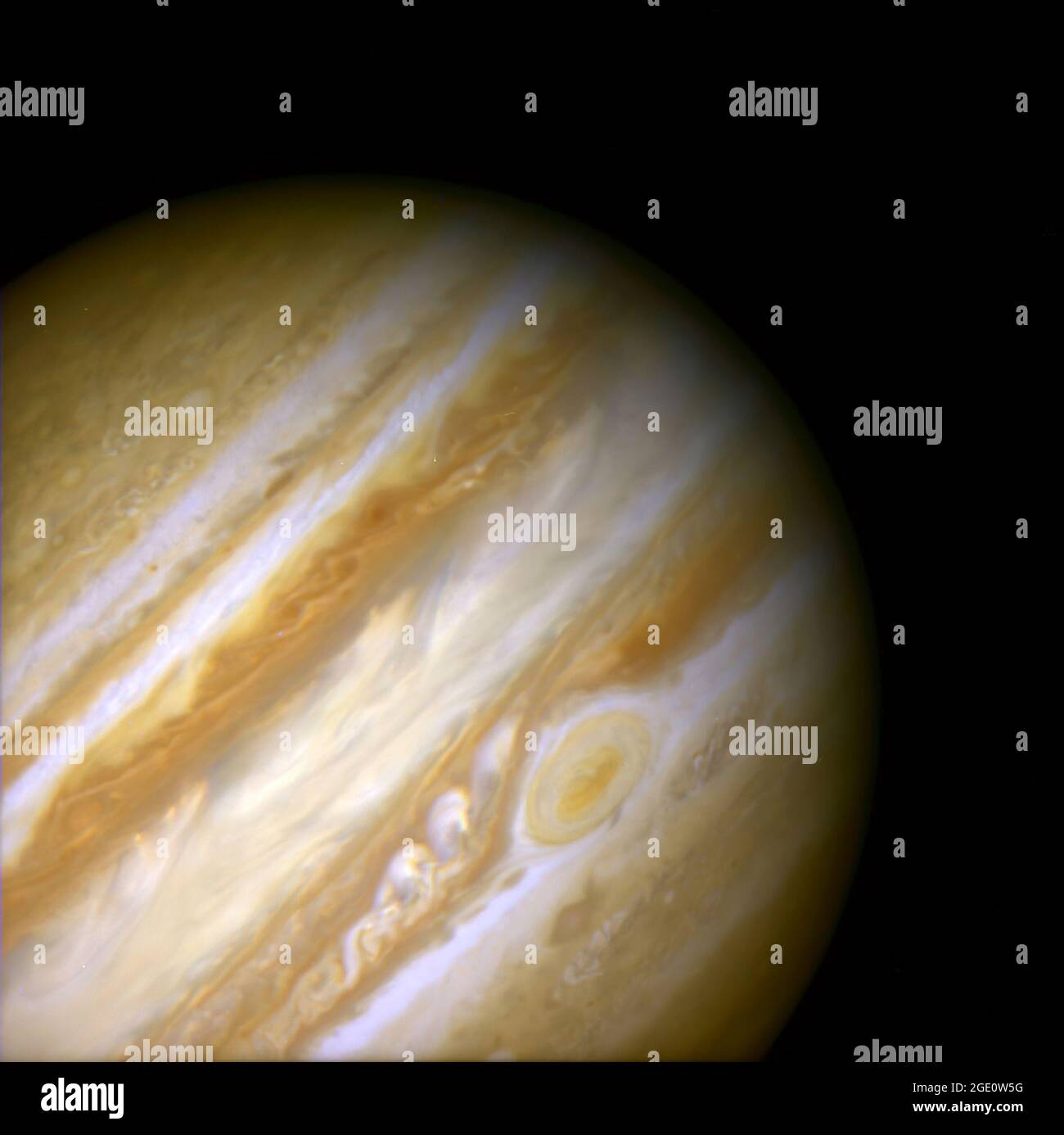 When 17th-century astronomers first turned their telescopes to Jupiter, they noted a conspicuous reddish spot on the giant planet. This Great Red Spot is still present in Jupiter's atmosphere, more than 300 years later. It is now known that it is a vast storm, spinning like a cyclone. Unlike a low-pressure hurricane in the Caribbean Sea, however, the Red Spot rotates in a counterclockwise direction in the southern hemisphere, showing that it is a high-pressure system. Winds inside this Jovian storm reach speeds of about 270 mph. The Red Spot is the largest known storm in the Solar System. With Stock Photo