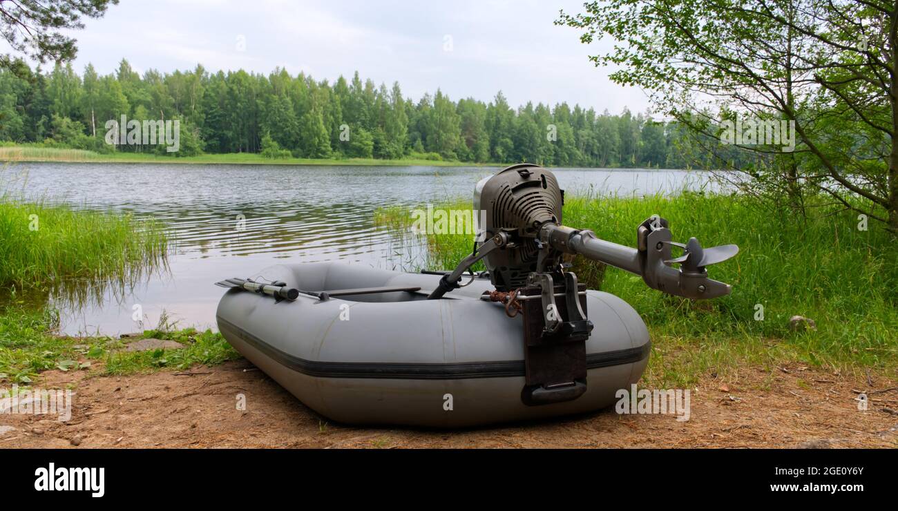 Rest and fishing in nature. A picturesque place on the lake. An inflatable  boat on the shore of a Soodla Reservoir Stock Photo - Alamy