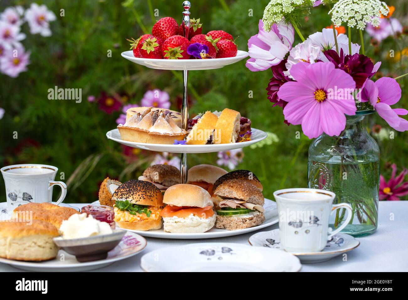Afternoon tea with cakes and sandwiches Stock Photo - Alamy