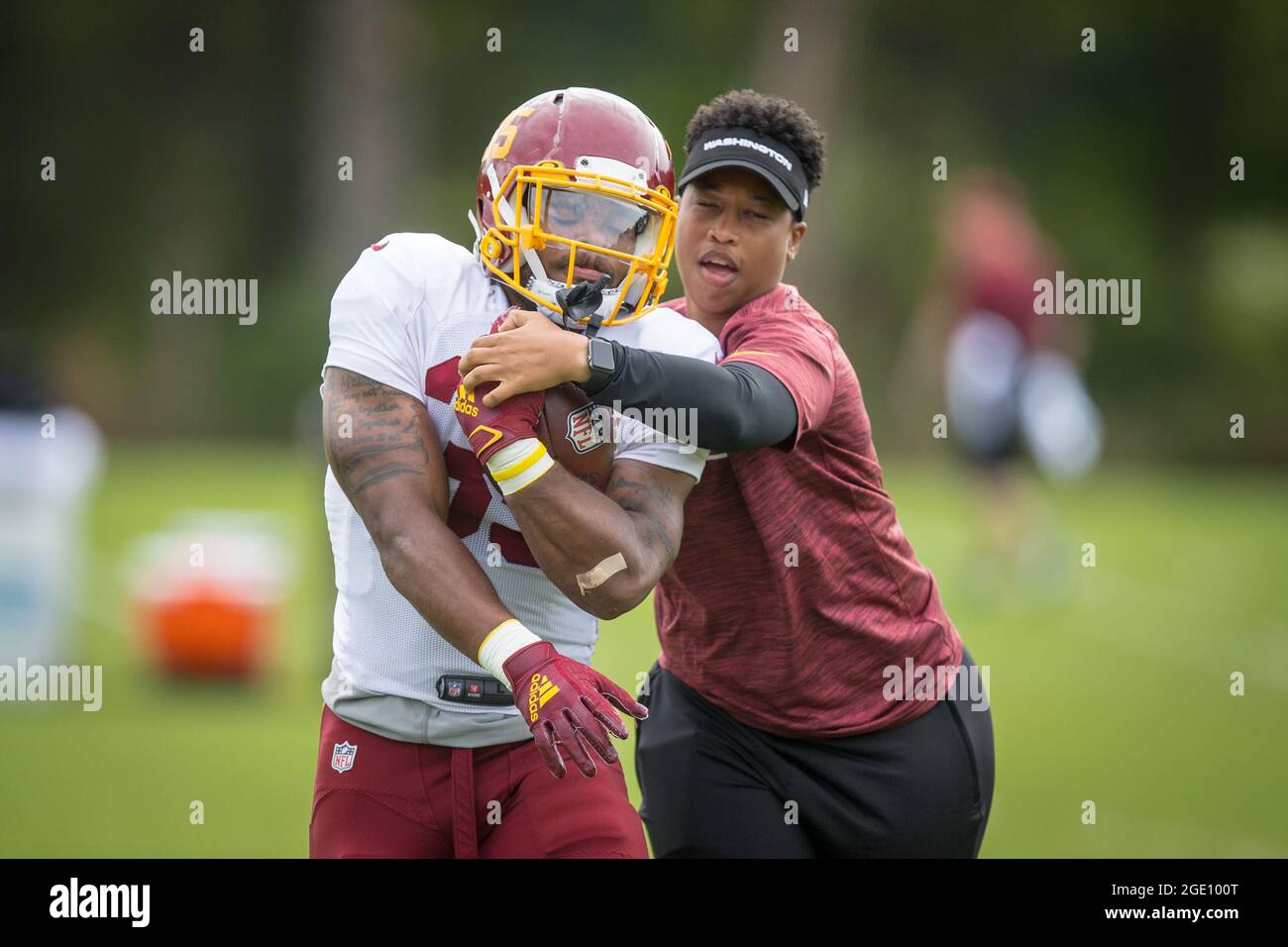 August 15, 2021: Washington Football Team runningback Jaret Patterson (35)  works on ball security drills during the team's NFL football training camp  practice at the Washington Football Team Facilities in Ashburn, Virginia